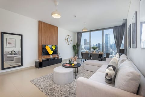 Premium Apartment, Balcony, Canal View | Living area | 65-inch Smart TV with cable channels