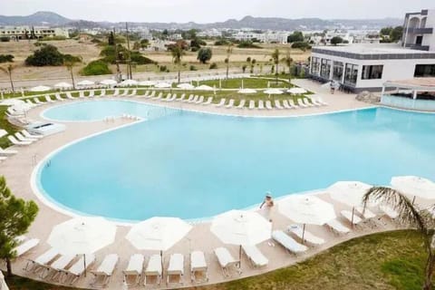Outdoor pool, open 10:00 AM to 7:00 PM, pool umbrellas, sun loungers