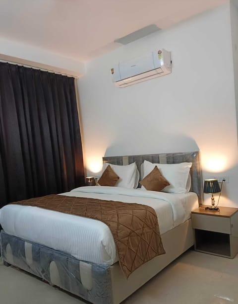 Desk, laptop workspace, bed sheets