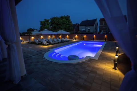 Seasonal outdoor pool, open 6:00 AM to 10:00 PM, sun loungers