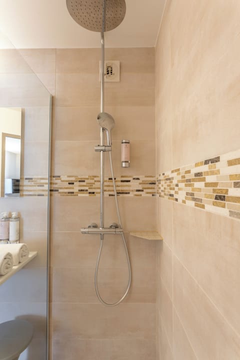 Shower, rainfall showerhead, designer toiletries, hair dryer