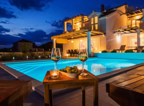 Villa (FourBedroom Villa with heated pool) | Outdoor pool | Outdoor pool, pool umbrellas, sun loungers