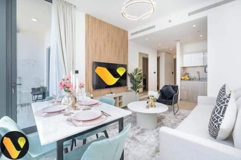 Luxury Apartment, Balcony, City View | Living area | 65-inch Smart TV with cable channels