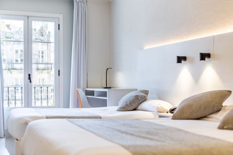 Superior Triple Room, City View | Memory foam beds, desk, laptop workspace, blackout drapes