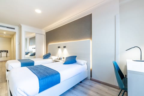 Memory foam beds, desk, laptop workspace, blackout drapes