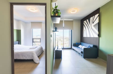 Club Suite, Balcony, City View | Living area | 55-inch Smart TV with digital channels, streaming services
