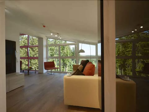 Deluxe Suite | Living room | Flat-screen TV