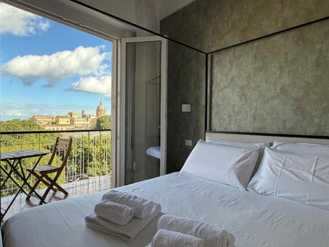 Exclusive Quadruple Room, Balcony, City View | Free WiFi, wheelchair access