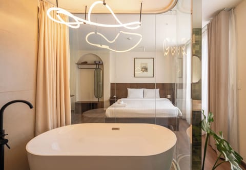 Exclusive Studio | Bathroom | Separate tub and shower, free toiletries, hair dryer, slippers