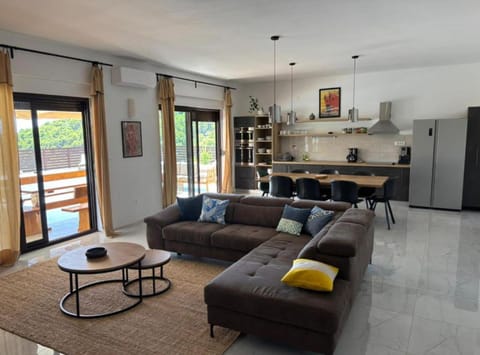 Villa (Four bedroom villa with pool) | Living room | 32-inch flat-screen TV with satellite channels