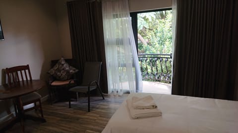 Luxury Twin Room, Balcony, Garden View | Free minibar, in-room safe, laptop workspace, blackout drapes