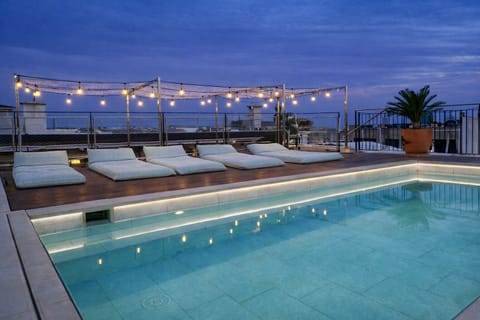 3 outdoor pools, a waterfall pool, pool umbrellas, sun loungers
