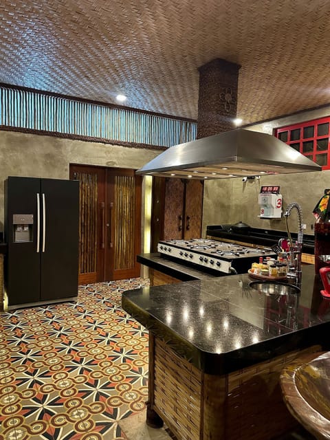 Deluxe House, Garden View | Private kitchen | Highchair
