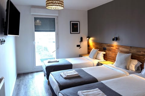 Family Room, Multiple Beds | Premium bedding, laptop workspace, soundproofing, iron/ironing board