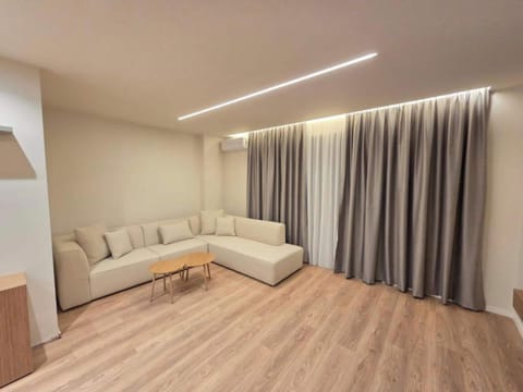 Deluxe Apartment, 2 Bedrooms | Living area | 42-cm flat-screen TV with satellite channels