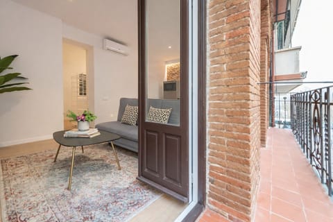 Classic Apartment, Balcony | Living area | Flat-screen TV