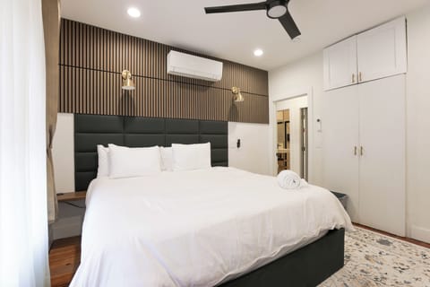Family Suite, City View | In-room safe, desk, laptop workspace, iron/ironing board