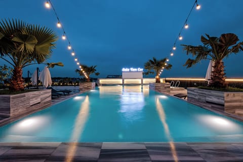 Outdoor pool, pool umbrellas, sun loungers
