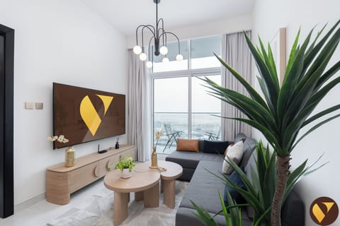 Deluxe Apartment | Living area | 65-inch Smart TV with cable channels