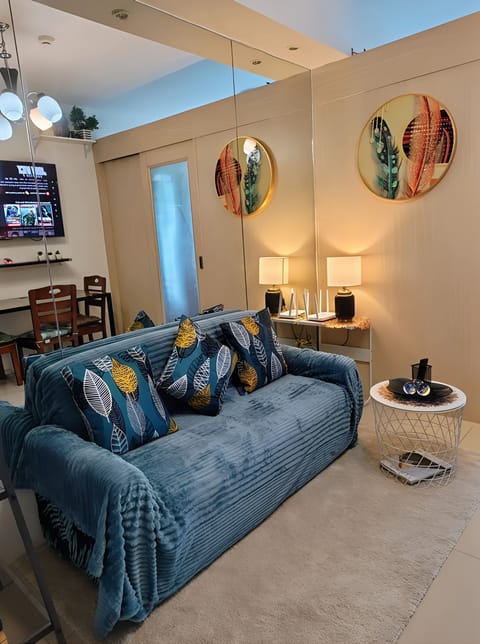 Standard Condo, City View | Living area | 45-inch LED TV with cable channels