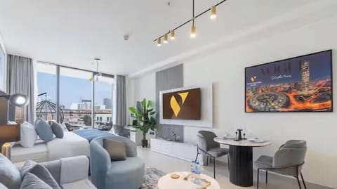 Luxury Studio, Balcony, City View | Living room | 55-inch Smart TV with cable channels