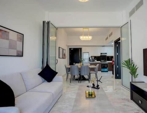 Luxury Apartment, Balcony, City View | Living area | 65-inch Smart TV with cable channels