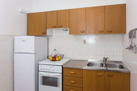 Apartment (One-Bedroom Apartment with Sea View) | Private kitchen | Fridge