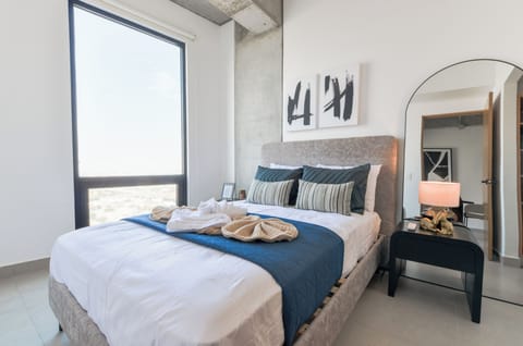 Suite, Balcony, City View | Laptop workspace, iron/ironing board, WiFi (free), bed sheets