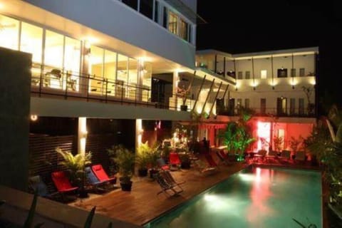 Outdoor pool, open 7 AM to 10:30 PM, pool umbrellas, sun loungers