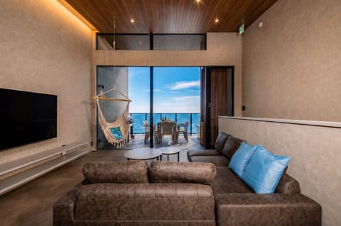 Luxury Villa, Ocean View | Living area | 55-inch flat-screen TV with cable channels