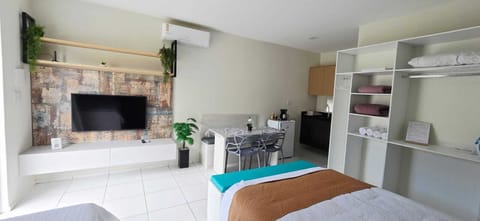 Family Room, Garden View | Blackout drapes, iron/ironing board, free WiFi
