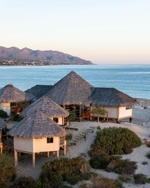 On the beach, white sand, beach towels, beach massages