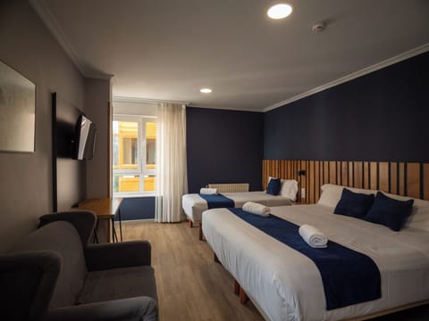 Family Triple Room, City View | Desk, free WiFi