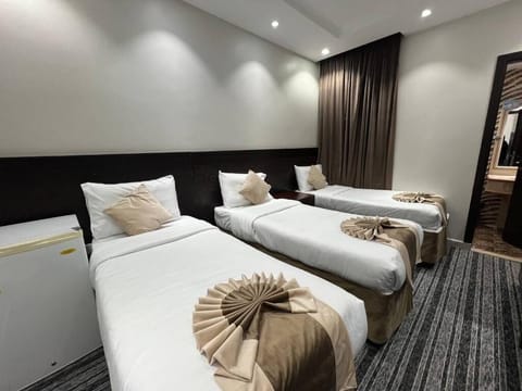 Triple Room, Balcony, City View | In-room safe, blackout drapes, iron/ironing board, free WiFi