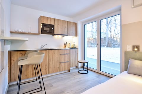 Signature Studio, 1 Queen Bed, Kitchen, Resort View | In-room safe, desk, laptop workspace, soundproofing