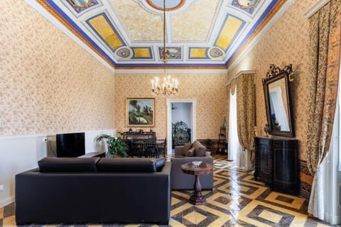 Presidential Studio Suite, Balcony, City View | Living area | TV