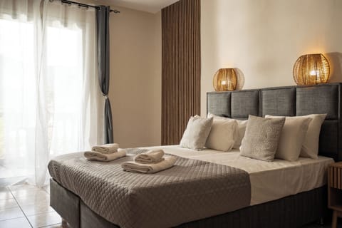 Comfort Suite, Garden View, Ground Floor | In-room safe, desk, iron/ironing board, free WiFi