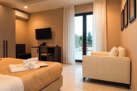 Junior Suite, Pool View | In-room safe, free WiFi