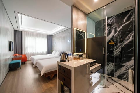 Family Twin Room, City View | Desk, laptop workspace, blackout drapes, iron/ironing board