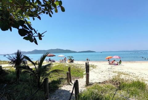 Apartment, Balcony, Partial Sea View | Beach | On the beach, white sand, beach umbrellas