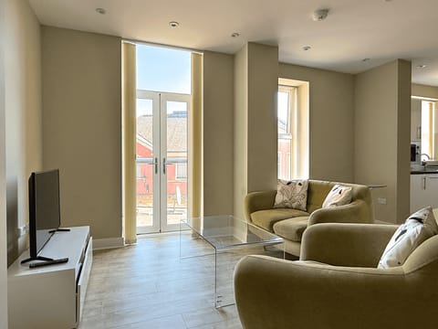 Standard Apartment | Living area | 40-inch flat-screen TV with cable channels