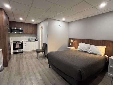 Deluxe Room, 1 Queen Bed, Kitchen | Memory foam beds, desk, blackout drapes, iron/ironing board