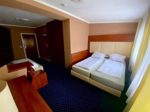 Family Triple Room, City View | Desk, laptop workspace, free WiFi