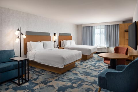 Premium bedding, Tempur-Pedic beds, desk, laptop workspace