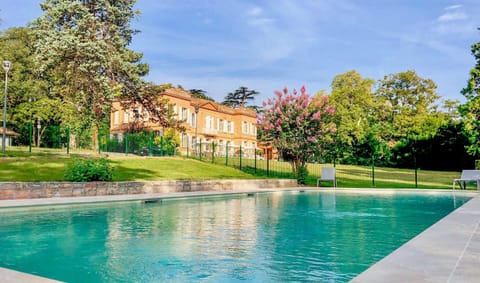 Seasonal outdoor pool, open 8:00 AM to 8:00 PM, pool umbrellas