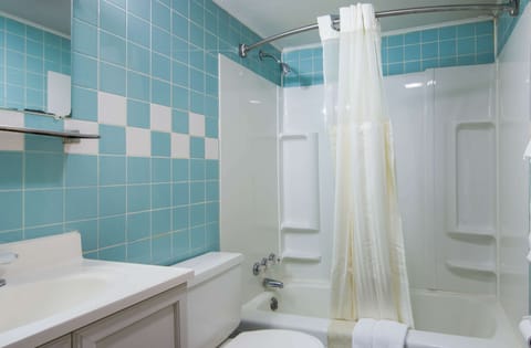 Suite, 1 King Bed, Jetted Tub | Bathroom | Combined shower/tub, free toiletries, towels, soap