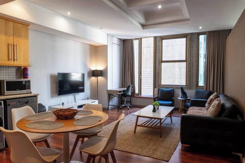 Apartment, 1 Bedroom, City View | Living room | Books