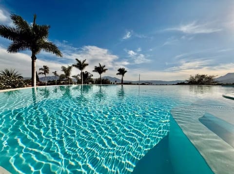 Outdoor pool, pool umbrellas, sun loungers