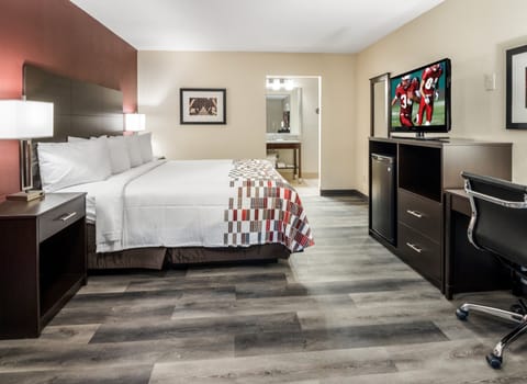 Desk, laptop workspace, blackout drapes, iron/ironing board