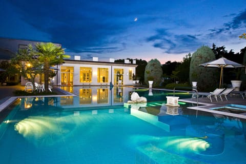 2 indoor pools, 2 outdoor pools, open 9 AM to 8 PM, pool umbrellas